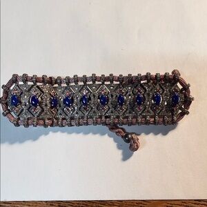 pave diamond and blue sapphire gemstone macrame bracelet with a braided cord